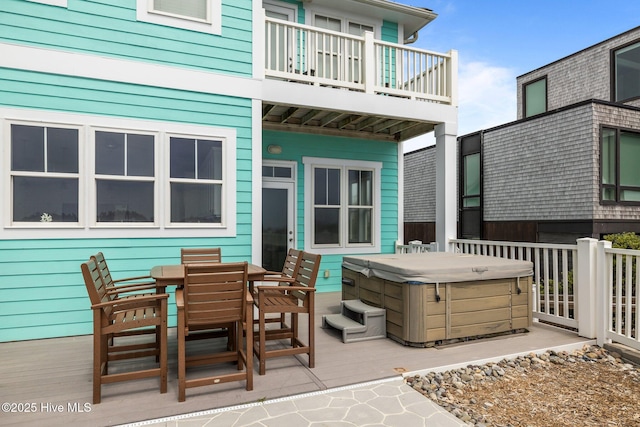 449 Maritime Pl, Pine Knoll Shores, NC 28512 - view of patio with a hot tub, a balcony, and outdoor dining space