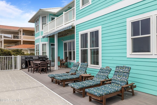 449 Maritime Pl, Pine Knoll Shores, NC 28512 - view of patio with a balcony and outdoor dining space