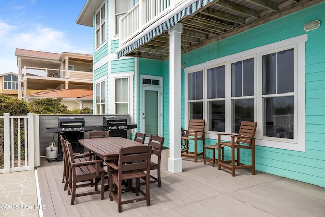 449 Maritime Pl, Pine Knoll Shores, NC 28512 - wooden terrace with outdoor dining area and a grill