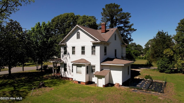 118 N 7th St, Smithfield, NC 27577 - rear view of property featuring a chimney, a lawn, and roof with shingles
