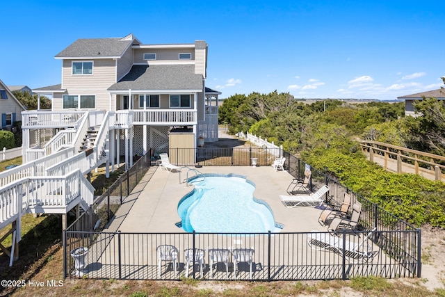 601 Caswell Beach Rd, Caswell Beach, NC 28465 - community pool featuring fence, a patio area, a deck, and stairway