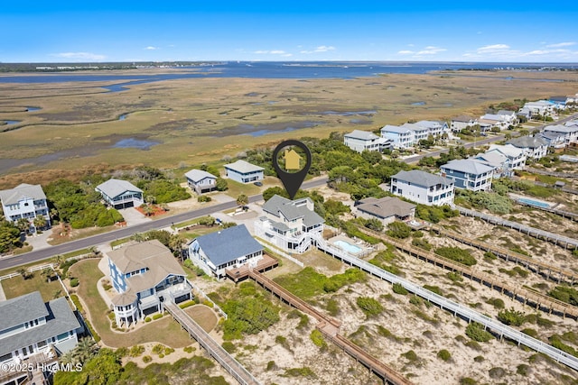 601 Caswell Beach Rd, Caswell Beach, NC 28465 - drone / aerial view featuring a residential view and a water view
