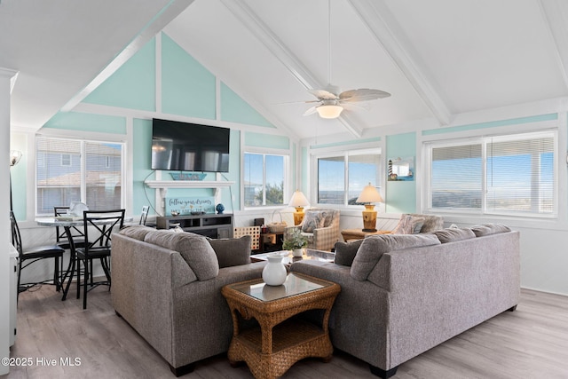 601 Caswell Beach Rd, Caswell Beach, NC 28465 - living room with a ceiling fan, vaulted ceiling with beams, and light wood-style flooring