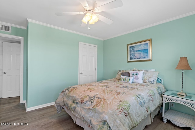 601 Caswell Beach Rd, Caswell Beach, NC 28465 - bedroom featuring a ceiling fan, crown molding, wood finished floors, baseboards, and visible vents