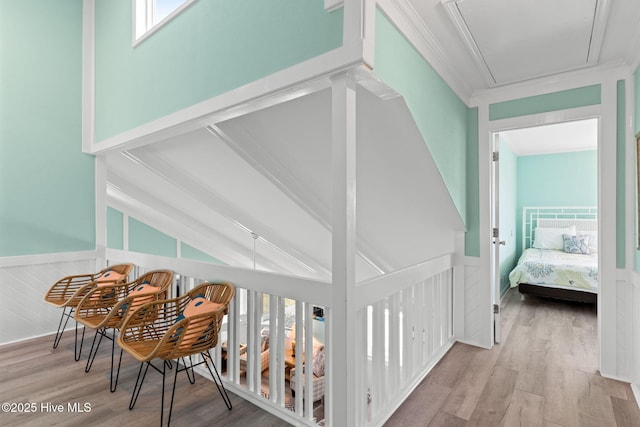 601 Caswell Beach Rd, Caswell Beach, NC 28465 - corridor with wainscoting, vaulted ceiling, crown molding, and wood finished floors
