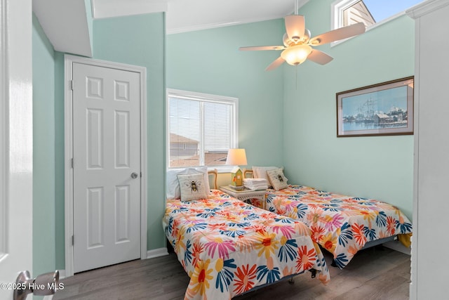 601 Caswell Beach Rd, Caswell Beach, NC 28465 - bedroom featuring wood finished floors, crown molding, and a ceiling fan