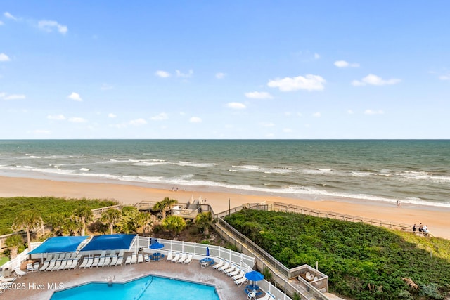 aerial view featuring a water view and a view of the beach