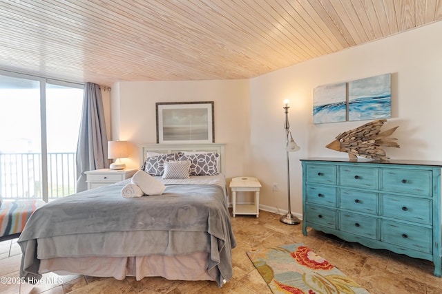 bedroom featuring expansive windows, wood ceiling, and access to exterior