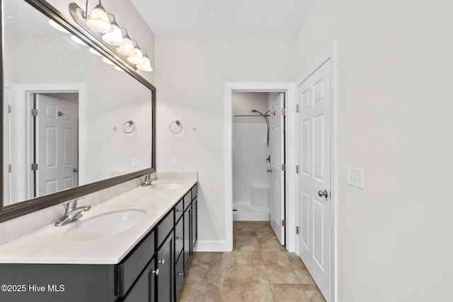 705 Shearwater Ln, Swansboro, NC 28584 - full bath with a shower, double vanity, and baseboards