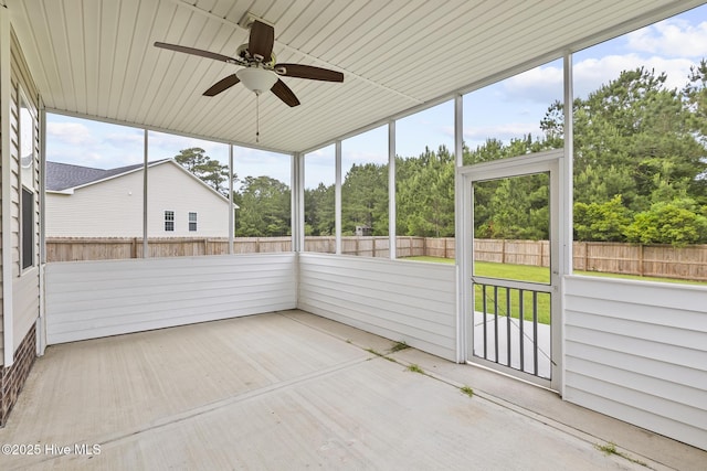 705 Shearwater Ln, Swansboro, NC 28584 - unfurnished sunroom with a ceiling fan and view of wooded area