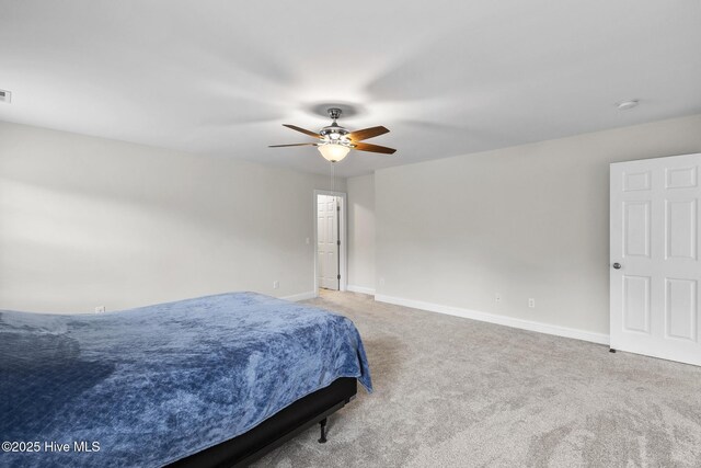 705 Shearwater Ln, Swansboro, NC 28584 - carpeted bedroom with baseboards and ceiling fan