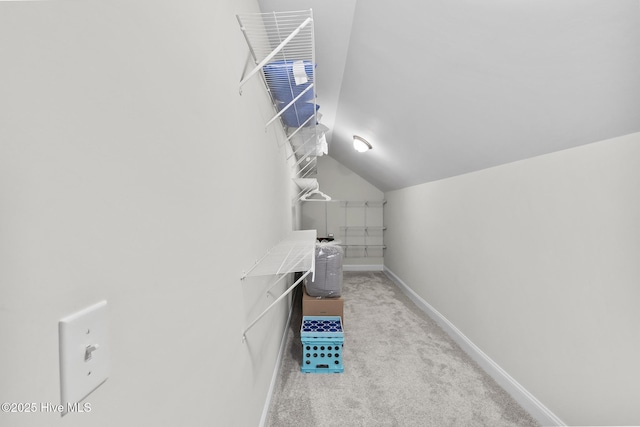 705 Shearwater Ln, Swansboro, NC 28584 - walk in closet featuring light colored carpet and lofted ceiling