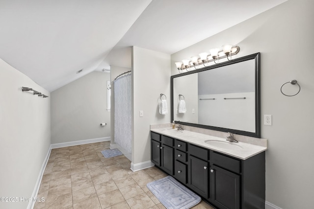705 Shearwater Ln, Swansboro, NC 28584 - bathroom with lofted ceiling, double vanity, baseboards, and a shower with shower curtain