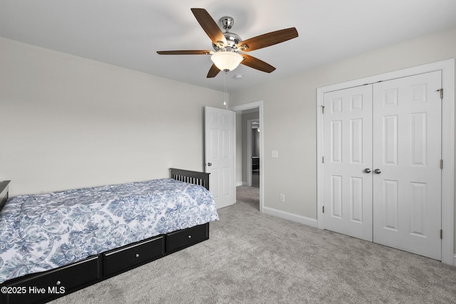 705 Shearwater Ln, Swansboro, NC 28584 - carpeted bedroom featuring a closet, ceiling fan, and baseboards