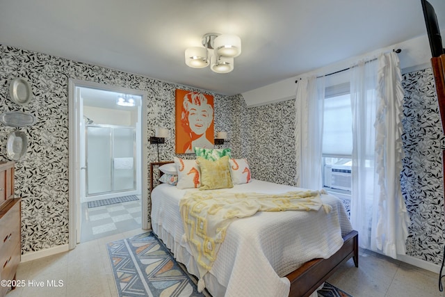 bedroom featuring baseboards, a chandelier, and wallpapered walls