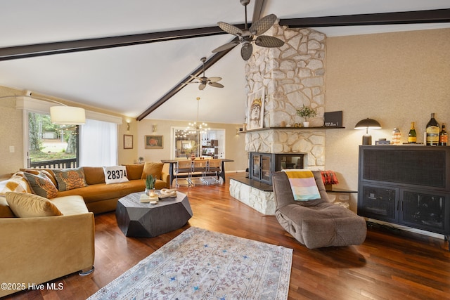 40 Inverness Rd, Pinehurst, NC 28374 - living area with ceiling fan, wood finished floors, a stone fireplace, and a chandelier