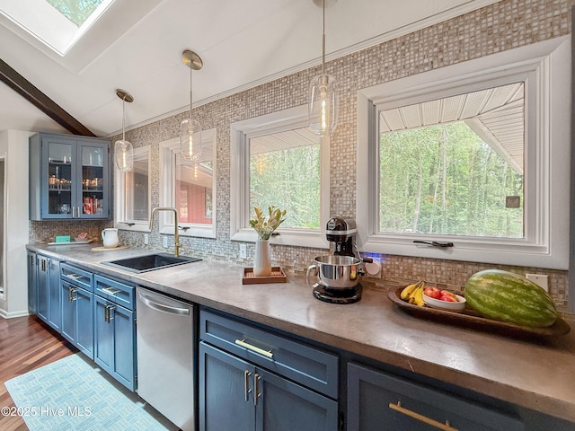 40 Inverness Rd, Pinehurst, NC 28374 - kitchen with dishwasher, blue cabinetry, decorative backsplash, decorative light fixtures, and glass insert cabinets
