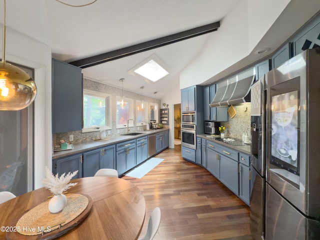 40 Inverness Rd, Pinehurst, NC 28374 - kitchen with stainless steel appliances, blue cabinets, and wall chimney exhaust hood