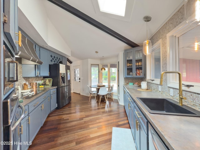 40 Inverness Rd, Pinehurst, NC 28374 - kitchen featuring blue cabinetry, fridge with ice dispenser, tasteful backsplash, pendant lighting, and dark wood finished floors