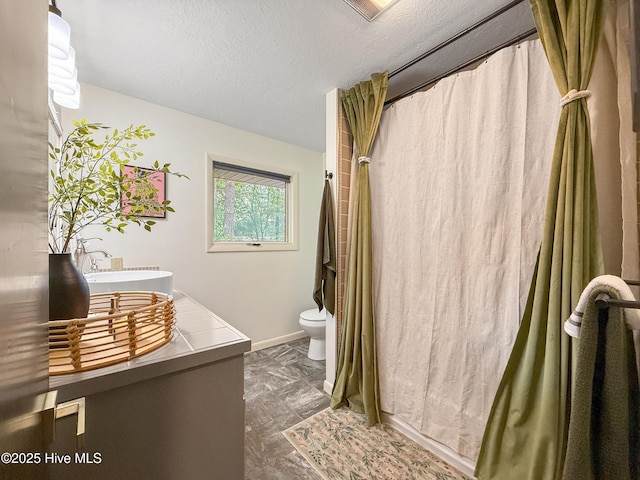 40 Inverness Rd, Pinehurst, NC 28374 - bathroom featuring vanity, a shower with curtain, and a textured ceiling