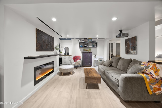 40 Inverness Rd, Pinehurst, NC 28374 - living room with a glass covered fireplace, light wood finished floors, and recessed lighting