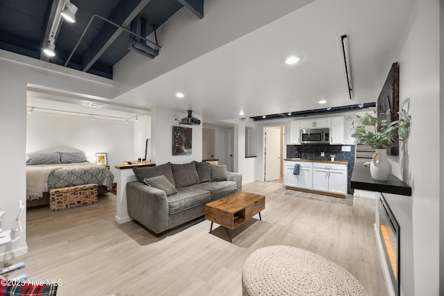 40 Inverness Rd, Pinehurst, NC 28374 - living room with light wood-style flooring, track lighting, and recessed lighting