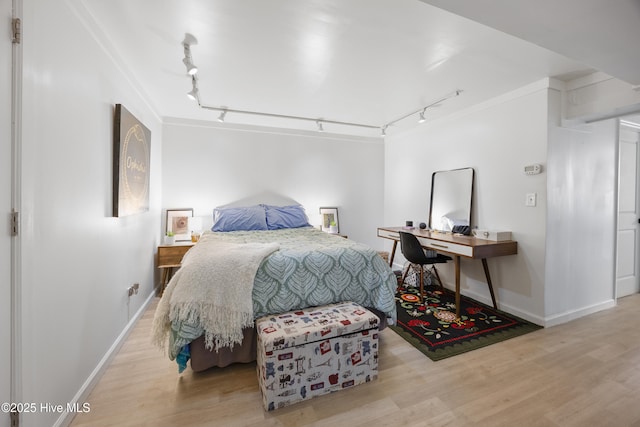 40 Inverness Rd, Pinehurst, NC 28374 - bedroom featuring rail lighting, wood finished floors, and a desk
