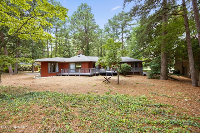40 Inverness Rd, Pinehurst, NC 28374 - rear view of property with a deck and a chimney