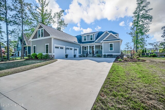 122 Back Creek Dr, Hertford, NC 27944 - craftsman-style house with a garage, a front lawn, driveway, and covered porch