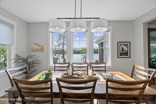 122 Back Creek Dr, Hertford, NC 27944 - dining area featuring a water view and wood finished floors