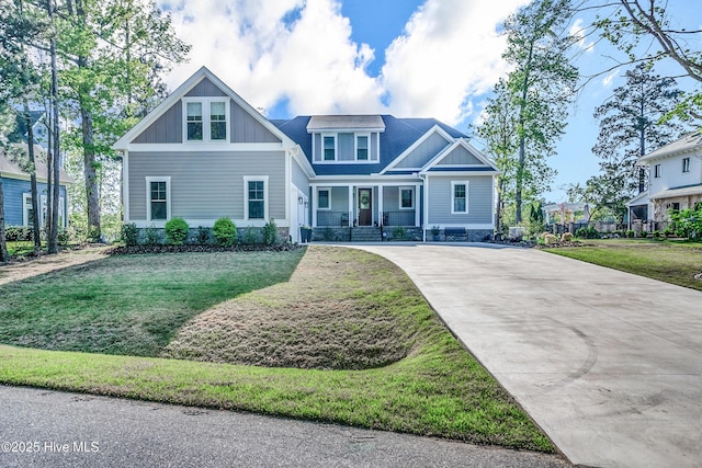 122 Back Creek Dr, Hertford, NC 27944 - craftsman house with covered porch, driveway, board and batten siding, and a front yard