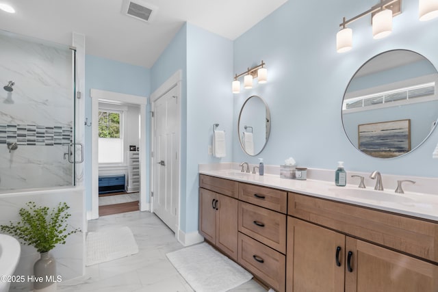 122 Back Creek Dr, Hertford, NC 27944 - full bathroom featuring visible vents, double vanity, marble finish floor, a sink, and a marble finish shower