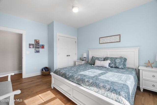 122 Back Creek Dr, Hertford, NC 27944 - bedroom featuring baseboards, wood finished floors, and a closet