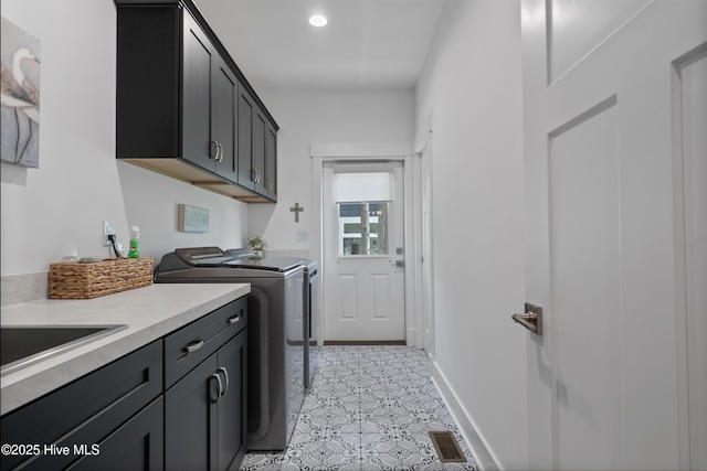 122 Back Creek Dr, Hertford, NC 27944 - laundry room featuring visible vents, cabinet space, light tile patterned floors, and washing machine and dryer