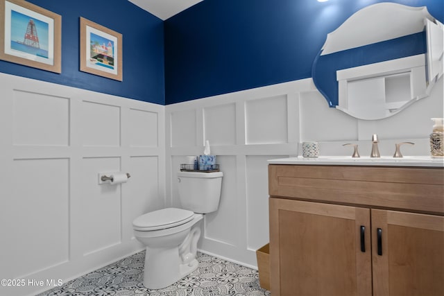 122 Back Creek Dr, Hertford, NC 27944 - half bath with vanity, a decorative wall, toilet, and a wainscoted wall