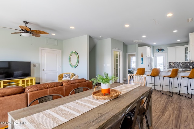 dining area featuring recessed lighting, a ceiling fan, and wood finished floors