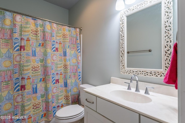 bathroom featuring vanity, toilet, and a shower with shower curtain
