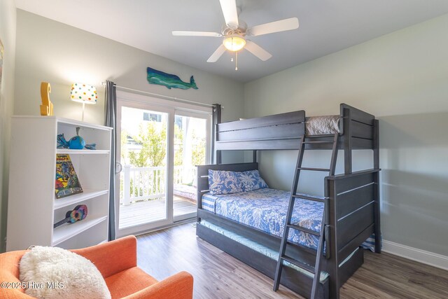 bedroom featuring baseboards, a ceiling fan, wood finished floors, and access to exterior
