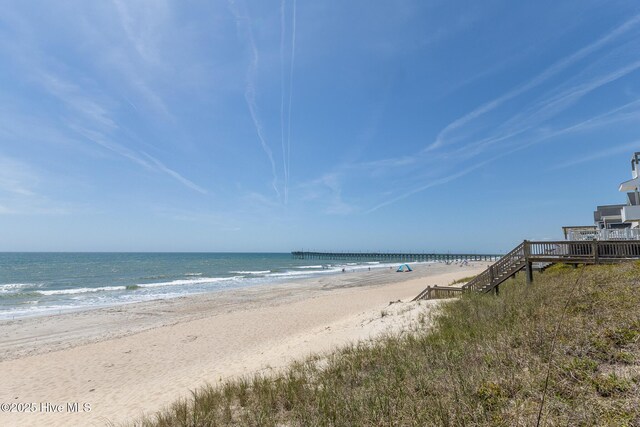 property view of water featuring a beach view
