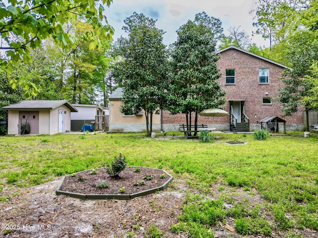 14 Sunnyvale Dr, Wilmington, NC 28412 - rear view of property with a lawn, an outbuilding, entry steps, and a shed