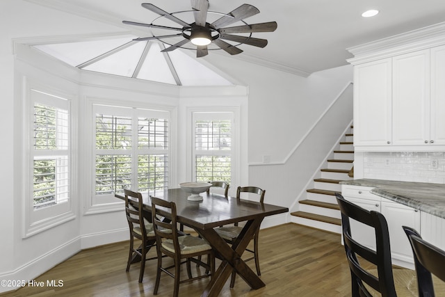 dining space featuring recessed lighting, a ceiling fan, crown molding, stairs, and dark wood-style flooring