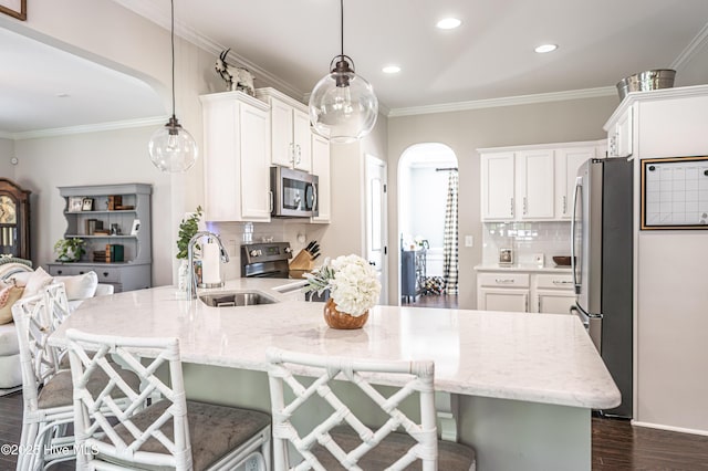 180 Cashew Loop, Cameron, NC 28326 - kitchen featuring a sink, white cabinets, stainless steel appliances, and a peninsula