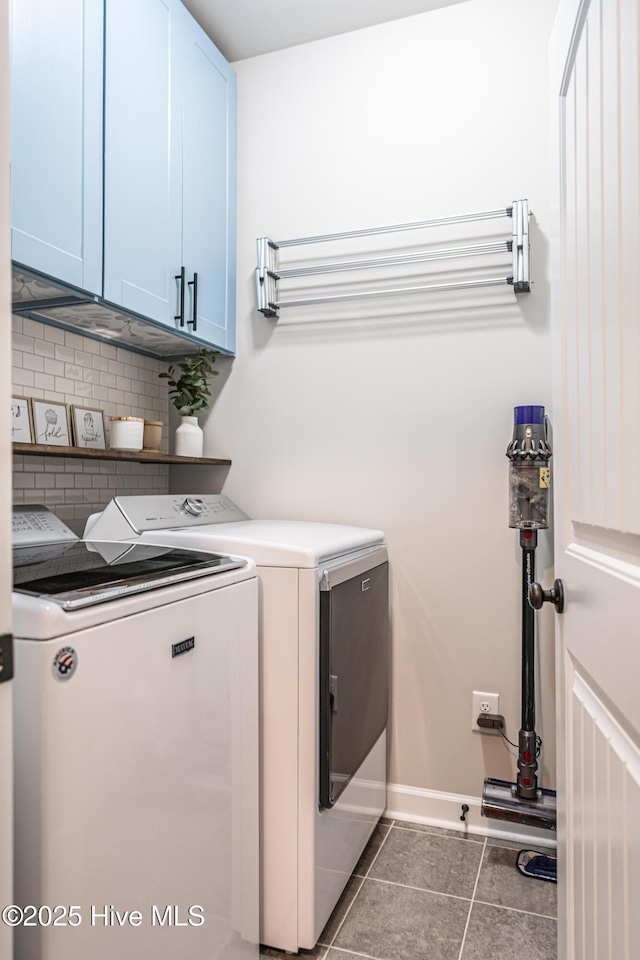 180 Cashew Loop, Cameron, NC 28326 - clothes washing area featuring cabinet space, tile patterned floors, washing machine and dryer, and baseboards