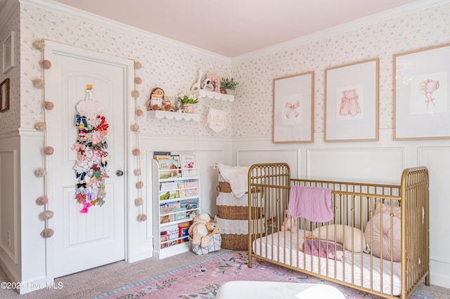 180 Cashew Loop, Cameron, NC 28326 - bedroom featuring ornamental molding, a decorative wall, wallpapered walls, a nursery area, and a wainscoted wall