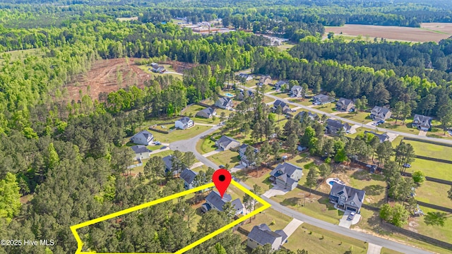 180 Cashew Loop, Cameron, NC 28326 - drone / aerial view featuring a residential view and a wooded view