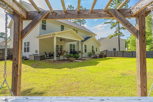 180 Cashew Loop, Cameron, NC 28326 - rear view of property featuring a fenced backyard, central AC unit, a ceiling fan, a patio, and a yard