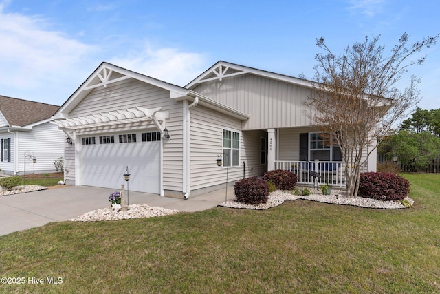 ranch-style house with a garage, covered porch, driveway, and a front yard