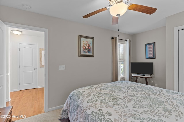 bedroom featuring baseboards and a ceiling fan