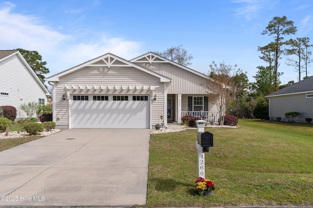 view of front facade featuring a porch, concrete driveway, a garage, and a front yard