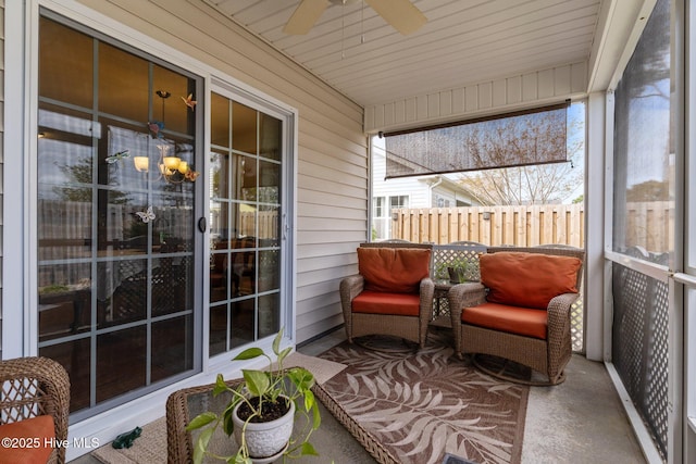 sunroom with a ceiling fan